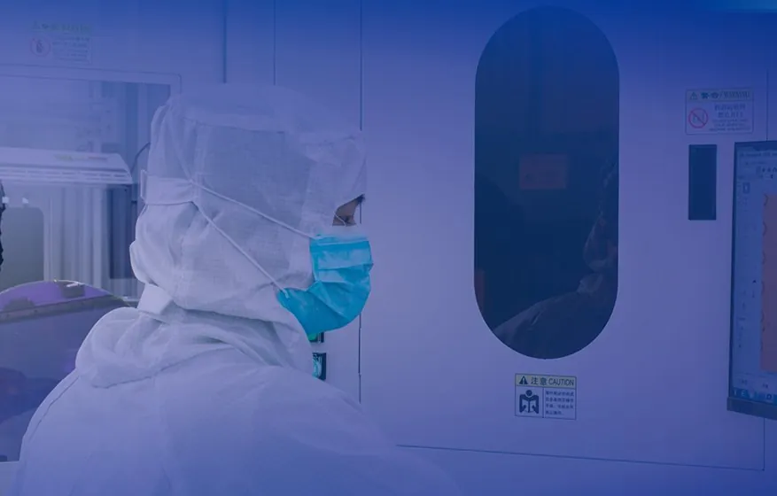 Operator using the AWL wafer inspection system in a cleanroom